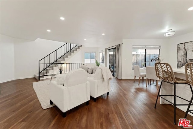 living room with dark hardwood / wood-style floors