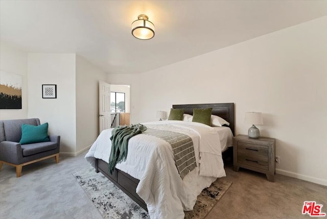 bedroom with light colored carpet