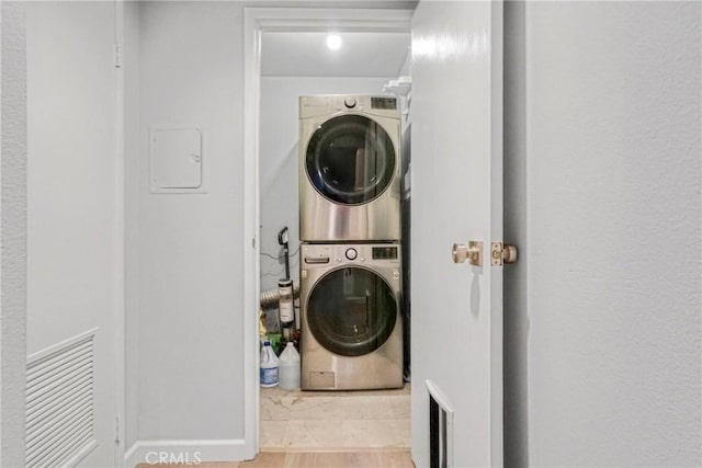 washroom with stacked washer / dryer