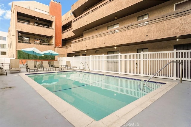 view of pool featuring a patio