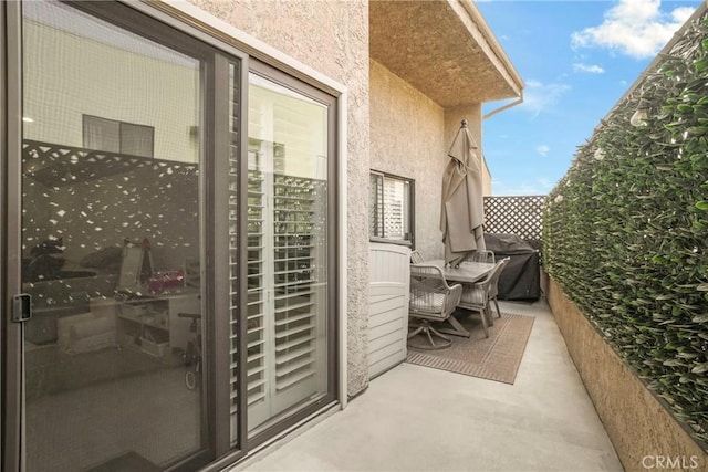 balcony featuring area for grilling