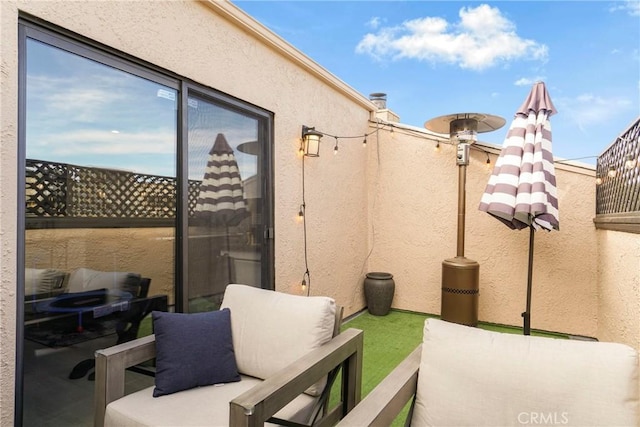 view of patio / terrace with a balcony