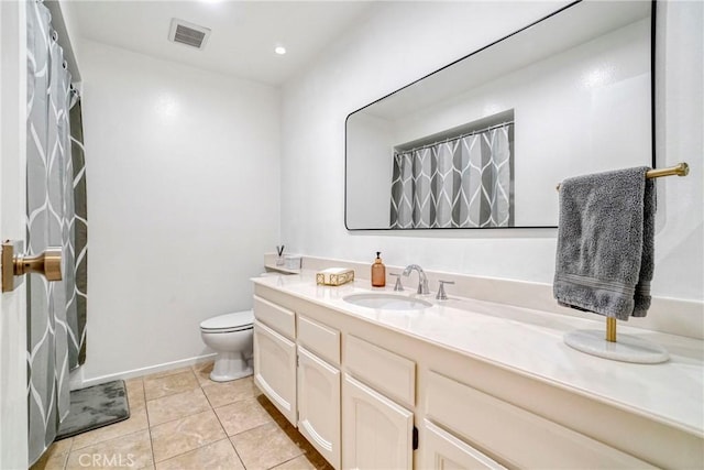 bathroom featuring toilet, a shower with shower curtain, tile patterned flooring, and vanity