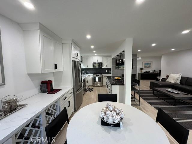 dining area featuring dark wood-type flooring