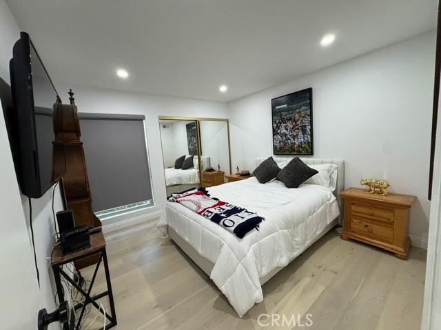 bedroom featuring light hardwood / wood-style floors