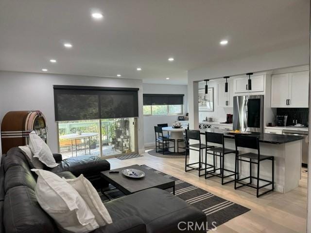 living room with light hardwood / wood-style flooring