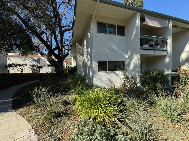 view of property exterior featuring a balcony