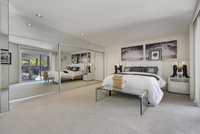 carpeted bedroom with access to exterior and a closet