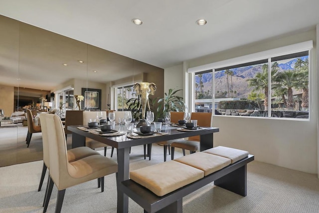 dining area with light colored carpet