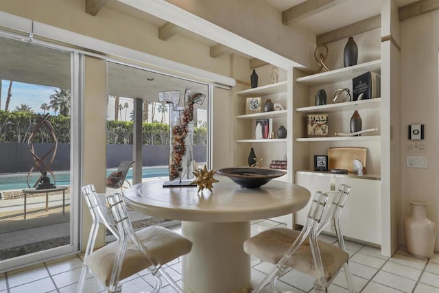 tiled dining room with beamed ceiling