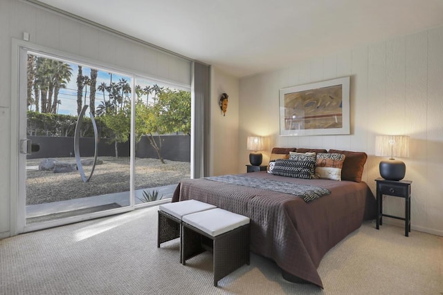 bedroom featuring carpet floors, access to outside, and multiple windows