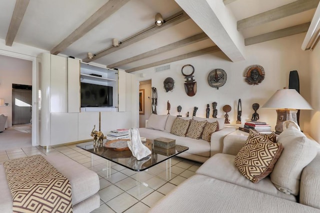 tiled living room with beamed ceiling