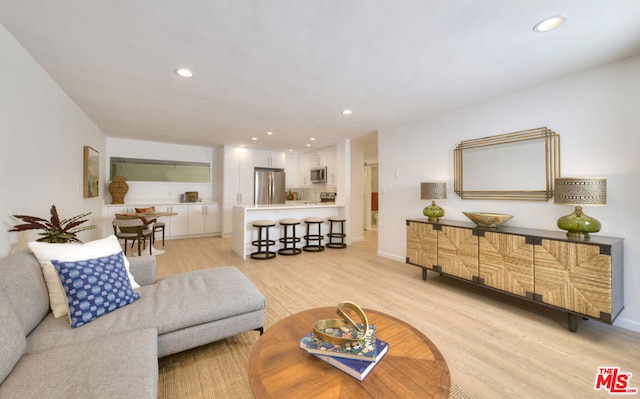 living room with light hardwood / wood-style flooring