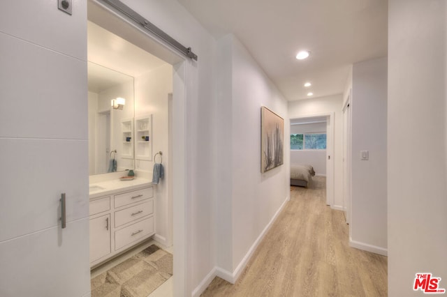 corridor featuring light hardwood / wood-style flooring