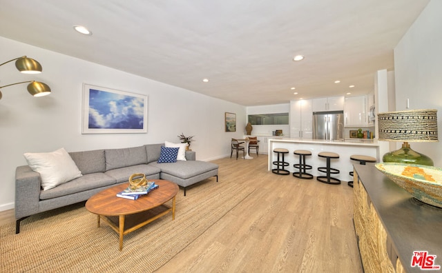 living room with light hardwood / wood-style floors