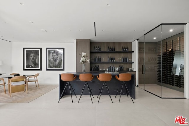 bar featuring light tile patterned floors