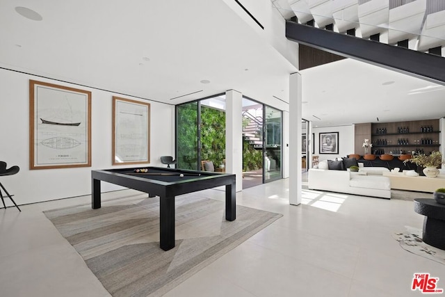 rec room with floor to ceiling windows and billiards