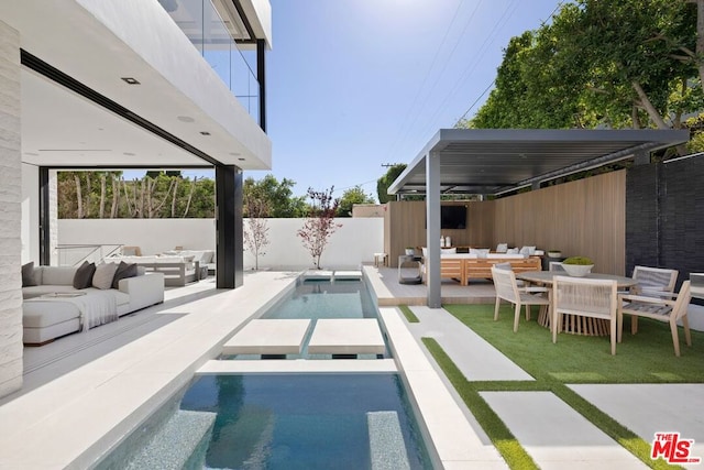 view of pool featuring a patio area and outdoor lounge area