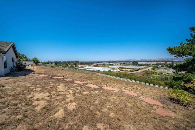 view of yard with a rural view