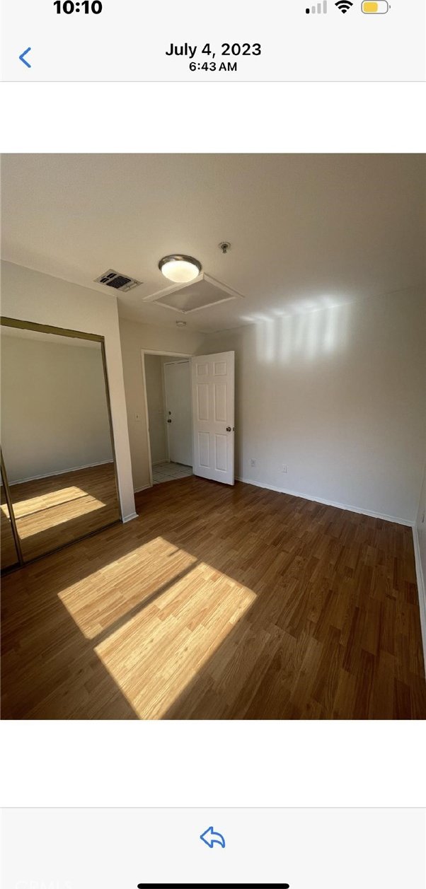 empty room with wood-type flooring