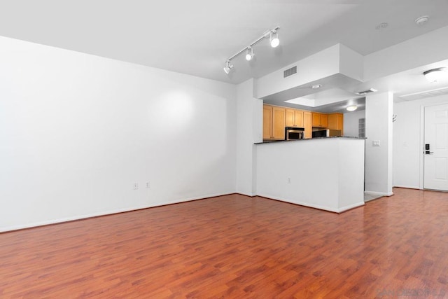 unfurnished living room featuring light hardwood / wood-style flooring