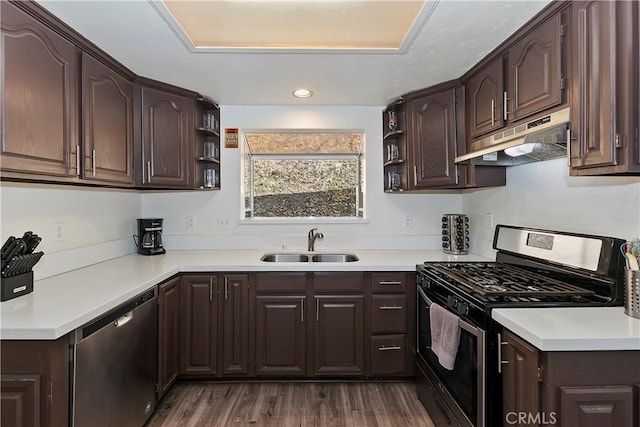 kitchen featuring dishwasher, gas stove, sink, hardwood / wood-style flooring, and dark brown cabinets