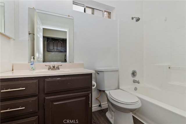 full bathroom with toilet, vanity, wood-type flooring, and bathing tub / shower combination