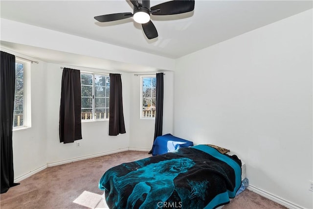 bedroom with ceiling fan and carpet flooring