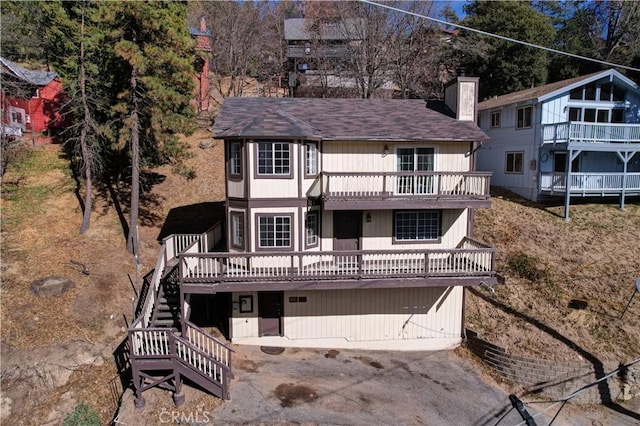 view of front of property featuring a wooden deck