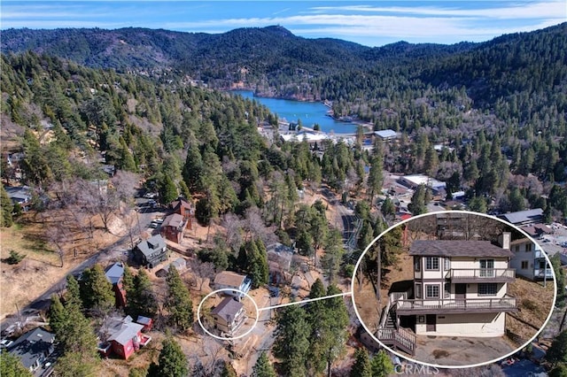 bird's eye view with a water and mountain view