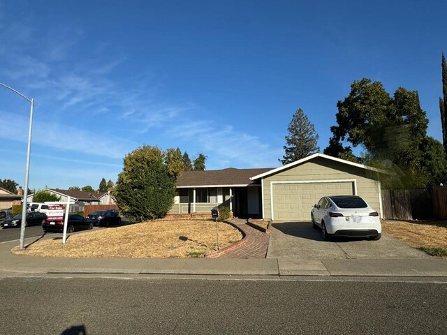 single story home featuring a garage