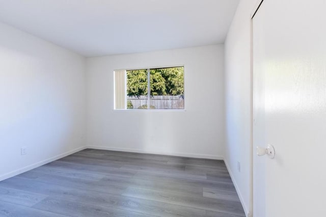 unfurnished room featuring hardwood / wood-style floors