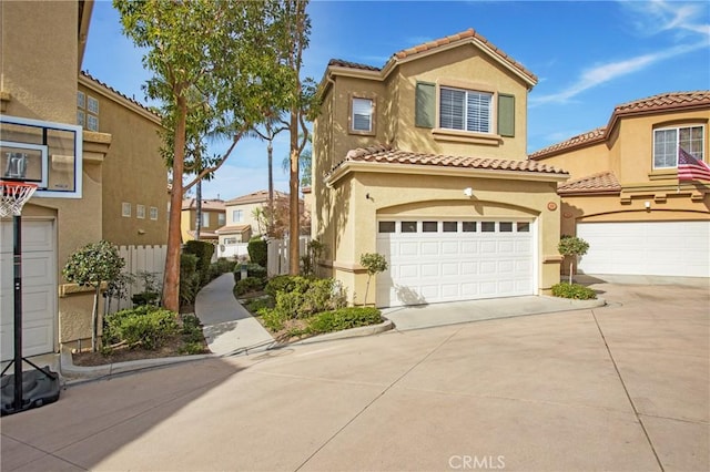 mediterranean / spanish-style home with a garage