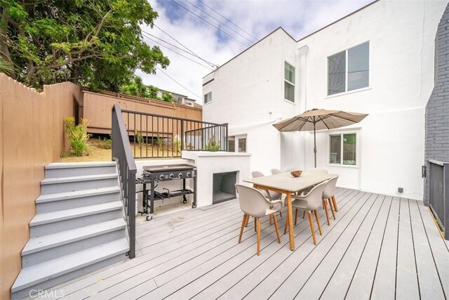 wooden deck featuring grilling area