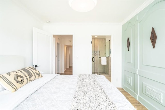 bedroom with ensuite bathroom and crown molding