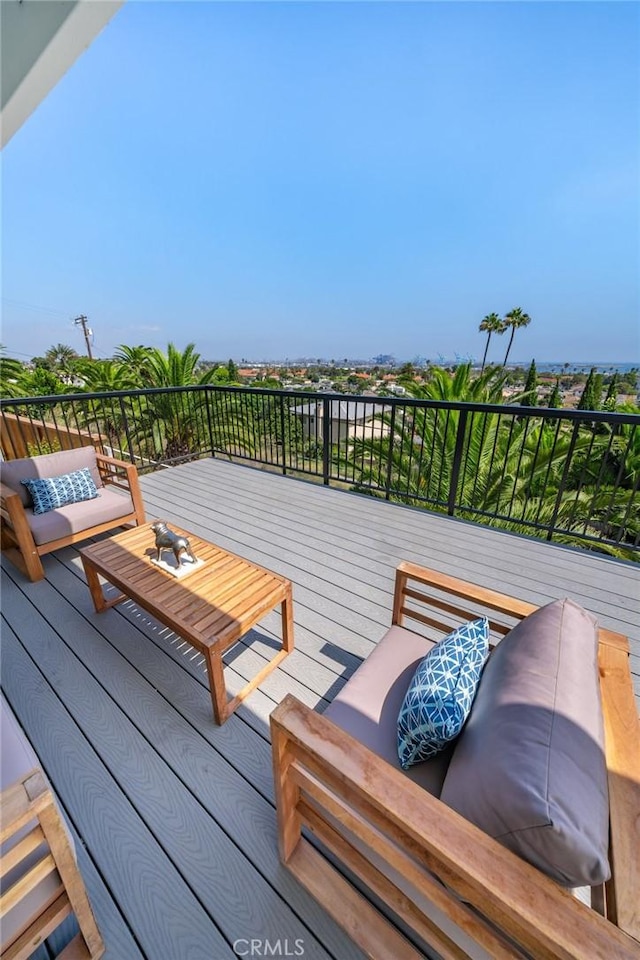 wooden deck with an outdoor living space