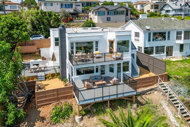 back of property with an outdoor hangout area