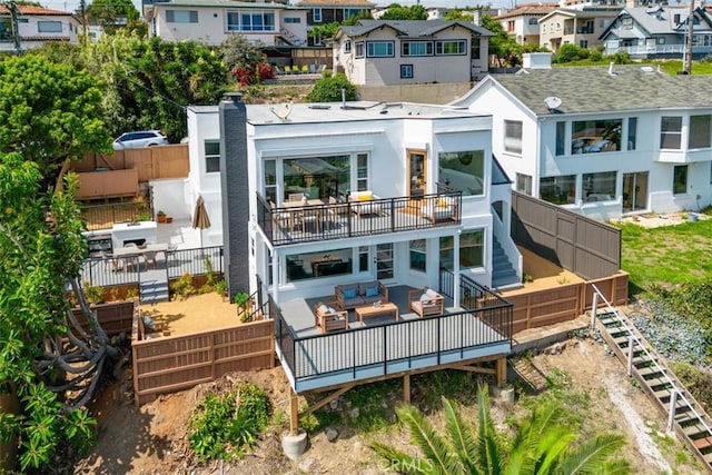 back of property with an outdoor living space