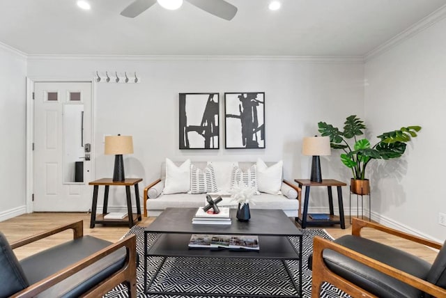 living room featuring ceiling fan, crown molding, and hardwood / wood-style floors