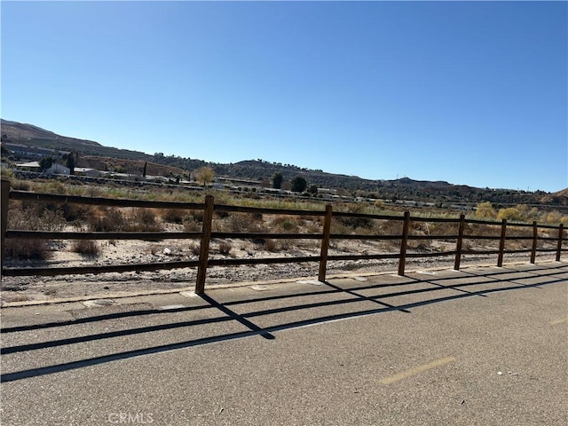 view of gate featuring a mountain view