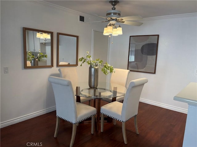 dining space featuring ceiling fan, crown molding, and dark hardwood / wood-style floors