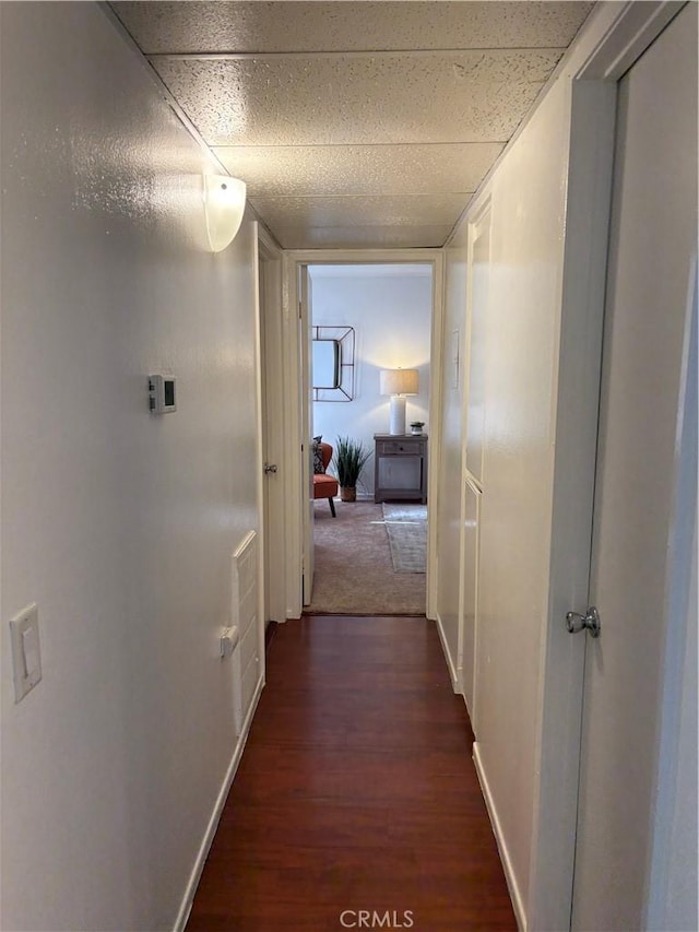 hallway featuring dark wood-type flooring