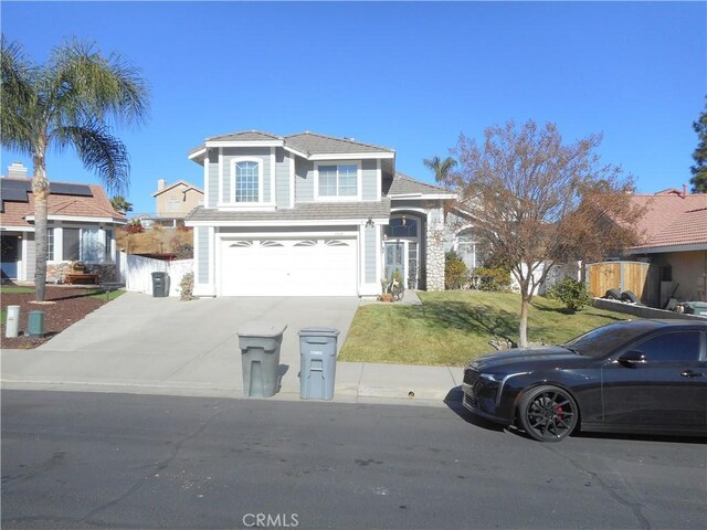 front facade featuring a front yard and a garage