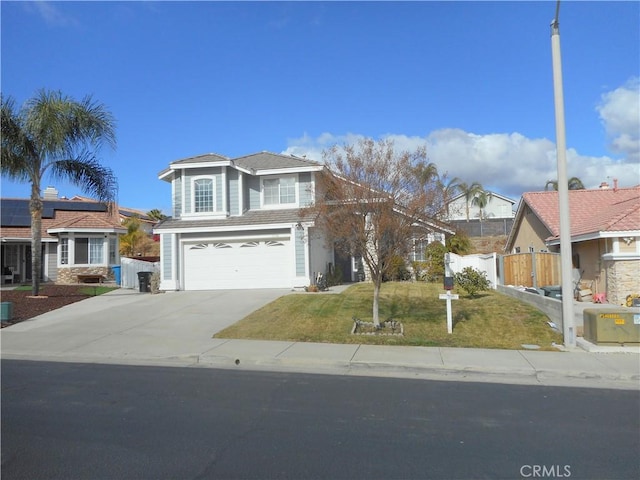 front of property featuring a garage and a front yard