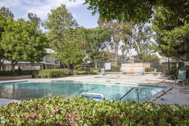 view of swimming pool with a patio