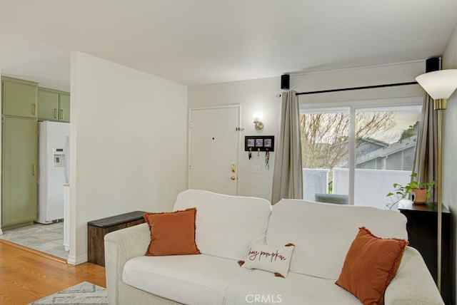 living room with light hardwood / wood-style flooring