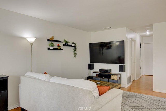 living room with light hardwood / wood-style floors