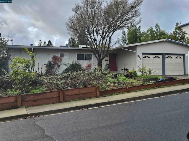 single story home featuring a garage