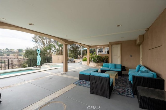 view of patio with an outdoor living space and a swimming pool with hot tub