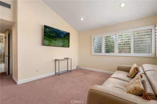 carpeted living room featuring high vaulted ceiling